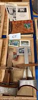 Overall view of stereoscopes with picture slides and paper materials on wooden table