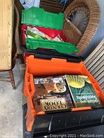 Two bins filled with various books and magazines including Country Look and gardening titles.