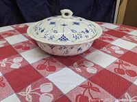 Photo showing the full covered vegetable dish/casserole with blue floral patterned white ceramic.