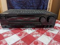 Front view of Kenwood KR-A3070 stereo receiver showing power switch, preset buttons and control knobs.