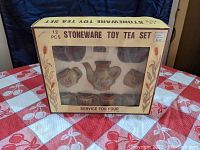 Original boxed 12 piece stoneware toy tea set with label showing toy tea service for four