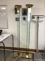 Full view of both 70-inch floor lamps side by side against wall