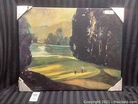 Front view of the unframed canvas painting showing two golfers on a green with trees and a water body in the background.