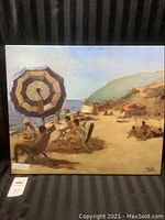 Full view of the unframed canvas painting depicting a beach scene with umbrellas and people relaxing, signed by Sala.