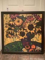 Full view of the framed sunflower still life painting by J. Doughall showing the bouquet in a purple vase with fruit on a table.