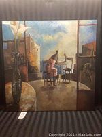 Full view of the Lourenco oil painting showing a woman seated at a table in an interior space with a vase of flowers on a countertop and abstract forms creating depth.