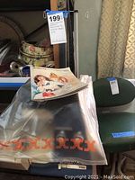 Machine covered in protective plastic with manual placed on top