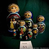 Full set of ten Fairytale Matryoshka nesting dolls arranged by size showing detailed hand-painted faces and traditional clothing, assorted fairy tale scenes on larger dolls.