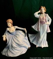 Both porcelain lady figurines, Royal Worcester standing and Coalport seated, showing front and side details