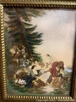 Close-up of the miniature hand painted scene depicting a group of people with detailed clothing and nature elements.