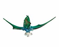 Front view of large chalet glass centerpiece showing wide wing span and central sail shapes.