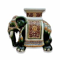 Front angle showing detailed ceramic elephant with decorative patterns and green glaze