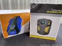 Two boxed air compressors side by side: one blue Akface brand and one black and yellow XD-787 model.