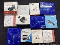 Overview of all boxed earphones in lot