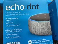 Box of Amazon Echo Dot smart speaker with Alexa features listed.
