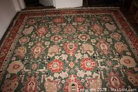 Overhead shot of full rug on floor showing geometric pattern and colors