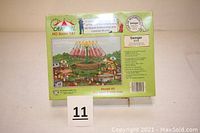 Back side of the sealed Carnival Series Swinger model kit box with image of assembled ride and product details.