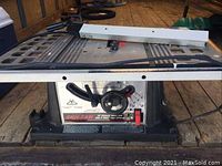 Full view of the Skilsaw 10 inch table saw showing metal tabletop and attached power cord.