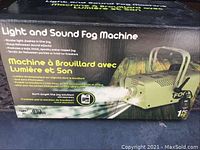 Box of Light and Sound Fog Machine showing product image and features