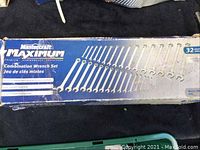 Photo of Mastercraft Maximum 32-piece combination wrench set box showing worn condition with image of wrenches displayed.