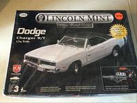 Front view of Lincoln Mint Dodge Charger R/T model kit box showing product details and image of the car.