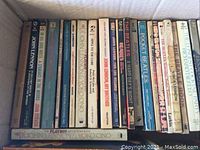 Full view of all Beatles books arranged in a box, showing spines with various titles and authors.