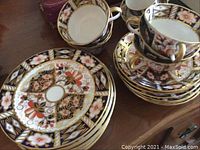 Six tea cups with matching saucers and six dessert plates in Imari pattern