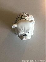 Top view of Royal Doulton Alfie bulldog figurine showing detailed facial expression and collar.