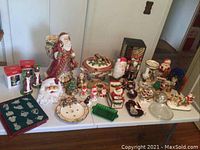 Table view of entire lot showing assorted ceramics and glassware