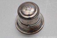 Top view of the round silver ring box showing embossed BR monogram on lid.