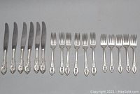 All 17 pieces arranged side by side (6 knives, 5 luncheon forks, 6 dinner forks)