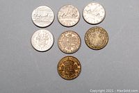 Seven coins arranged on a gray background showing obverse and reverse sides, highlighting Canadian and Great Britain coins.