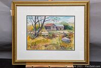 Framed watercolour painting depicting an old rustic barn scene with trees, fence and hills, signed by John W. Reid.