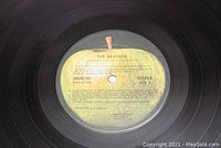 Close-up image of the vinyl record label, showing Side 3 track listing with yellow apple label by Apple Records. Records are stereo and play tested.