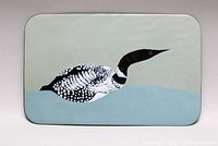 Front view of the rectangular metal wall plate showing the enamel-painted loon on water.