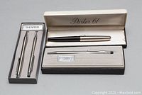 Photo of the Schaefer pen and pencil set in gray box alongside Cross pen in original box and Parker 61 fountain pen box.
