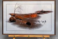 Full view of the framed artwork 'Napa Gold' showing the landscape with orange and brown colors, a tree, and cranes, within a brown frame.