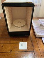 Image showing the interior of the dehydrator with fan and empty rack support slots.