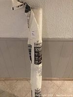 Full view of the rolled vapour barrier plastic, showing the roll in standing position and wrapped in packaging.