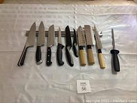 Nine cutting tools and magnetic mount displayed on white cloth
