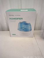 Boxed Homasiy by VicTsing humidifier showing front of packaging with brand and features.