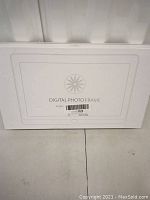 Front view of the white box labeled Digital Photo Frame showing product illustration