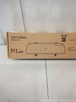 Front view of the Rexing M1 Pro dash cam box showing model name and key features including 12 inch screen, HD video resolution.