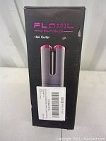 Front view of Flomil hair curler box showing product image and brand name