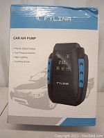 Box showing front of the Fylina car air pump, highlighting key features such as precise digital display, tire pressure monitor, night lighting, and touchscreen.
