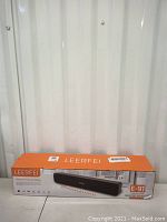 Front view of the LEERFEI speaker box showing model and some features.