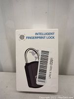 Image of box showing the label "Intelligent Fingerprint Lock" and a graphic of the lock.