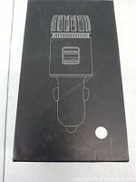 Black box packaging showing line drawing of air purifier and dual USB charger device.