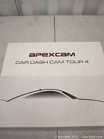 Top view of the Apexcam Car Dash Cam Tour 4 packaging box, showing the brand name and model.