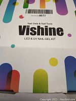 Close-up of the Vishine LED & UV Nail Gel Kit box, showing multicolor rounded design and brand name